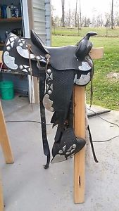 a SIMCO used show or parade horse saddle with all the extras,very beautiful